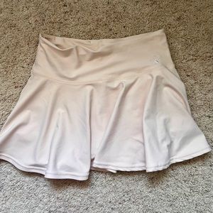 Cream flouncy skirt by Rebel Athletics size AS. Perfect condition.